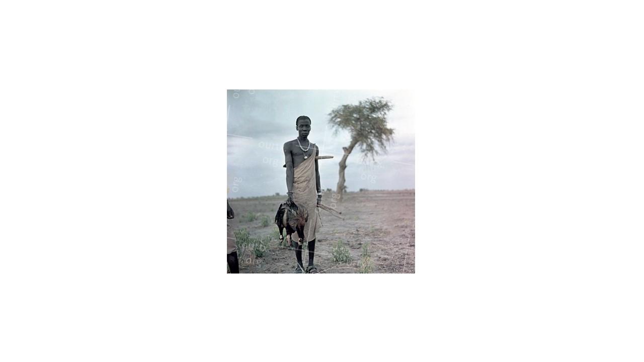 Nikolay Drachinsky. Young Dinka with Shot Ducks. Area of the City Al Manaqil, Upper Nile Province. Sudan, 1957. © Nikolay Drachinsky archive, courtesy of Alla Vakhromeeva, Archive Paper 14"x14", $500